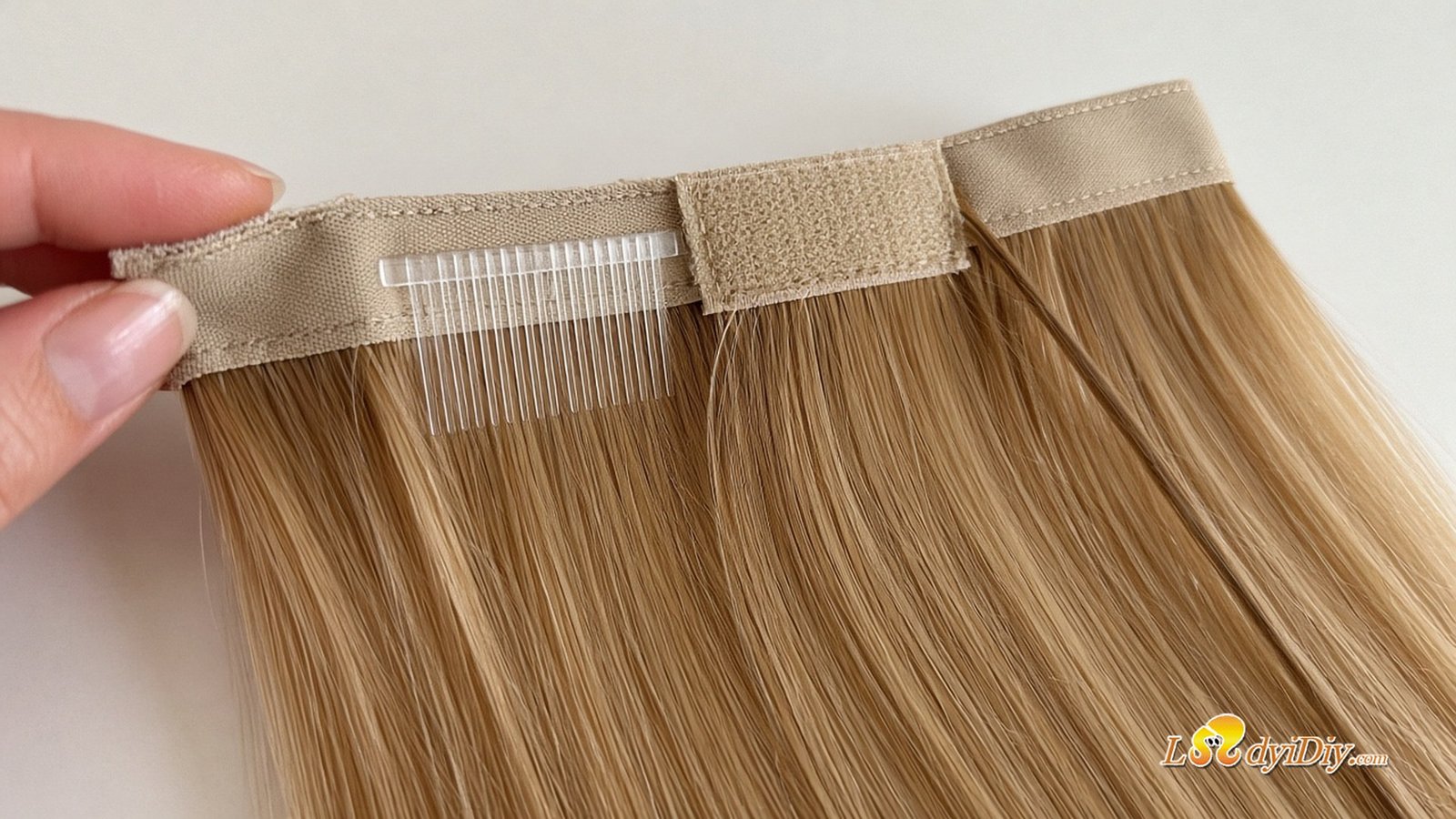 Close-up of the Ladyidiy human hair ponytail extension base with built-in comb, Velcro tab and wrap strand